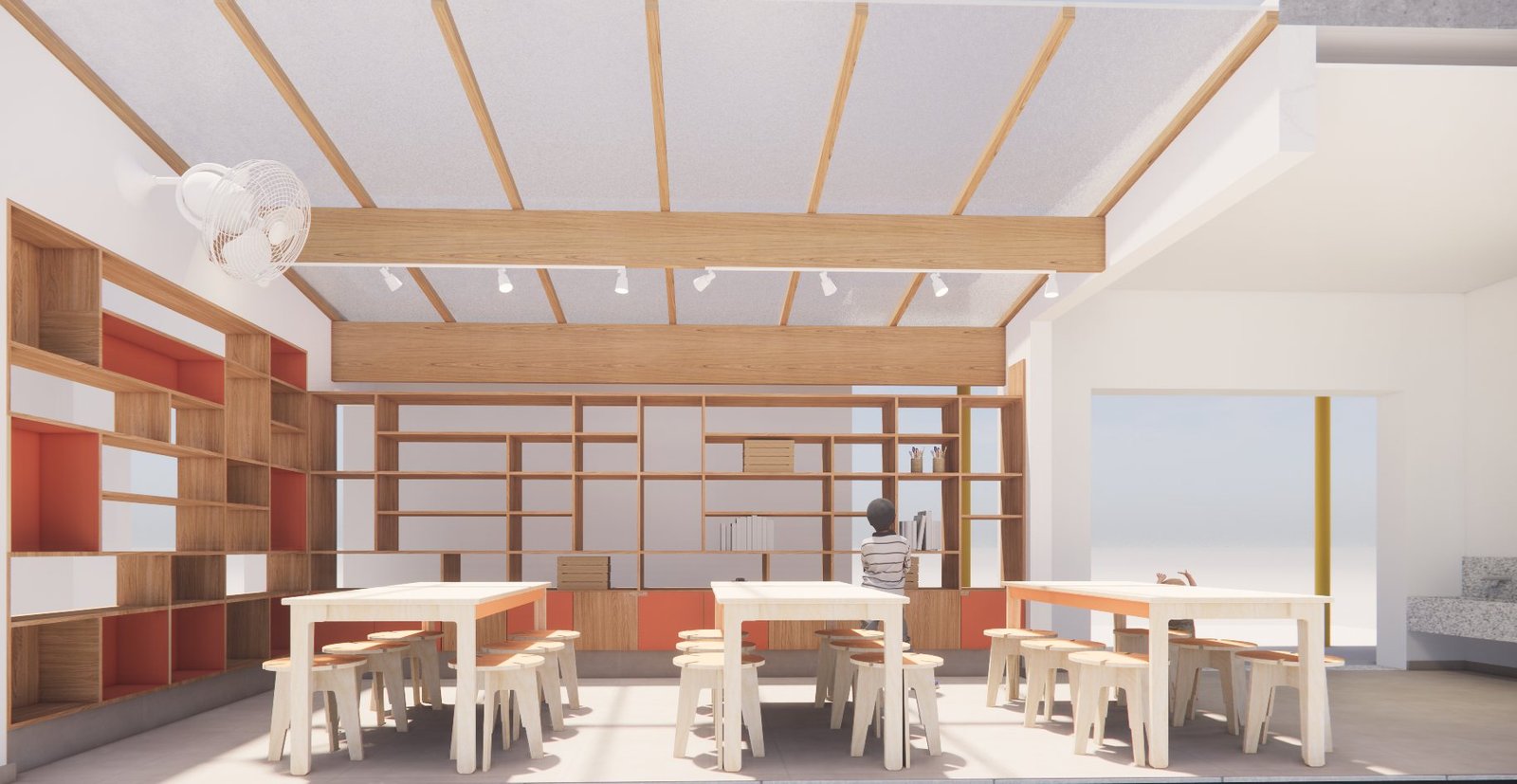 Vista frontal do novo ateliê, com estantes de madeira, mesas de compensado e estrutura de madeira na cobertura
