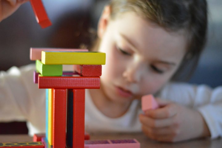 Canva - Girl Playing with Blocks